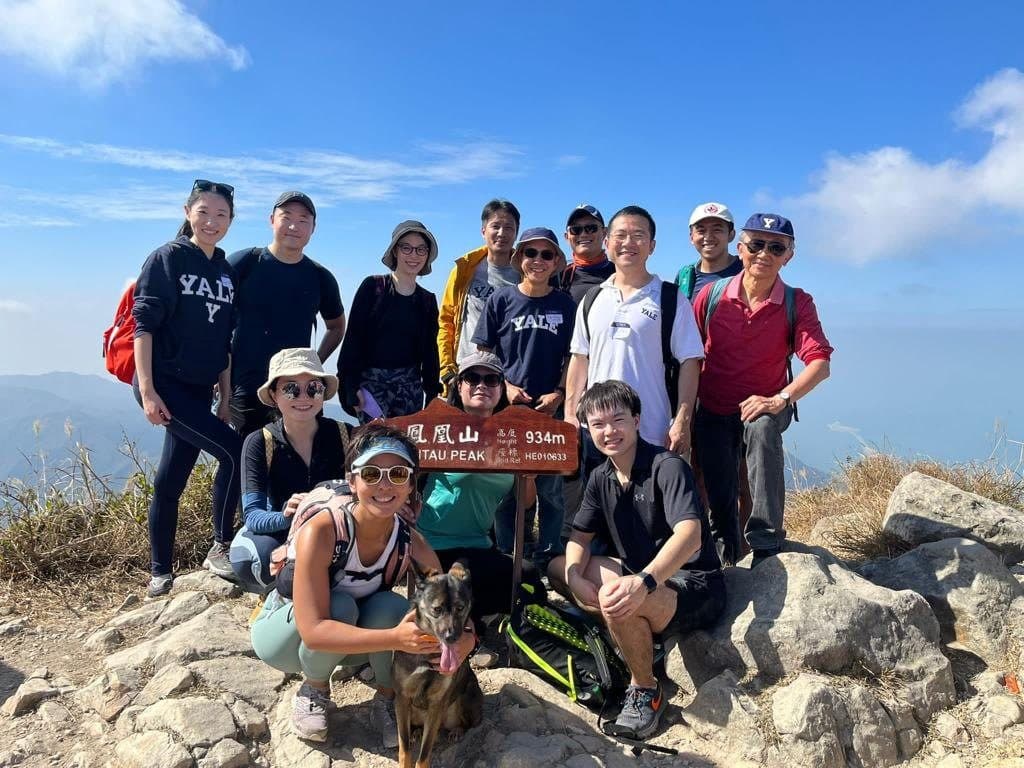 Hikers gathered at the Lantau Peak summit marker