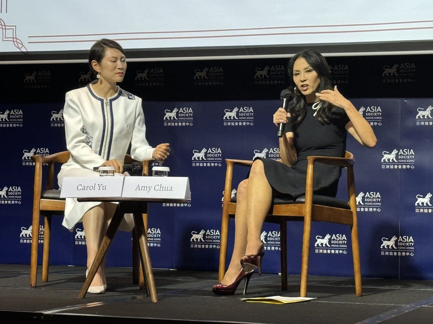 Amy Chua in conversation on stage at a Yale Club of Hong Kong event