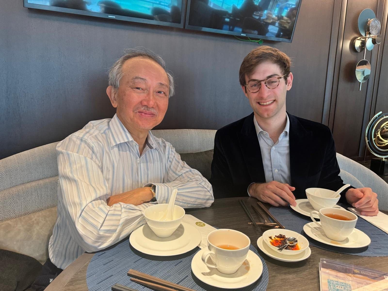 Two Yale alumni of different generations sharing lunch in Hong Kong